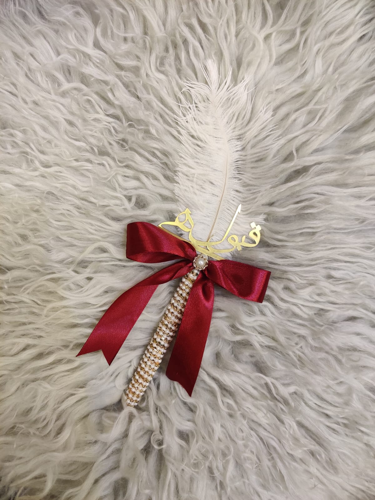 nikkah pen with maroon ribbon tie and feather