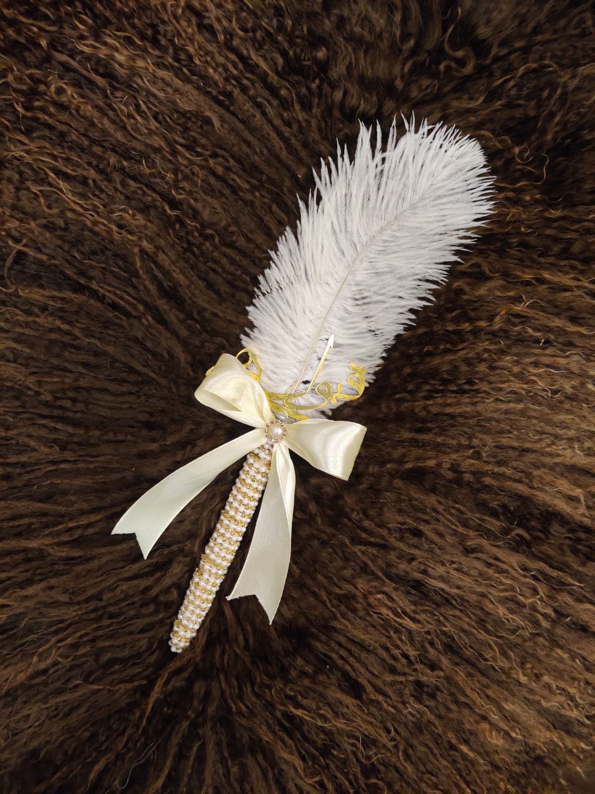 nikkah pen with white ribbon tie and feather